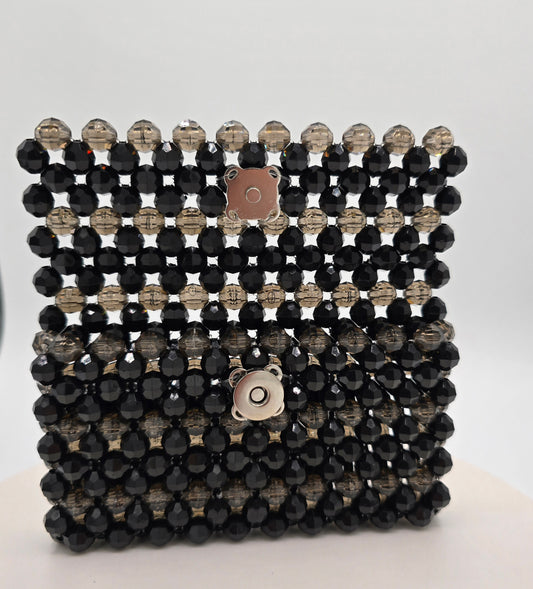 Open view of black translucent and opaque beaded wallet 
