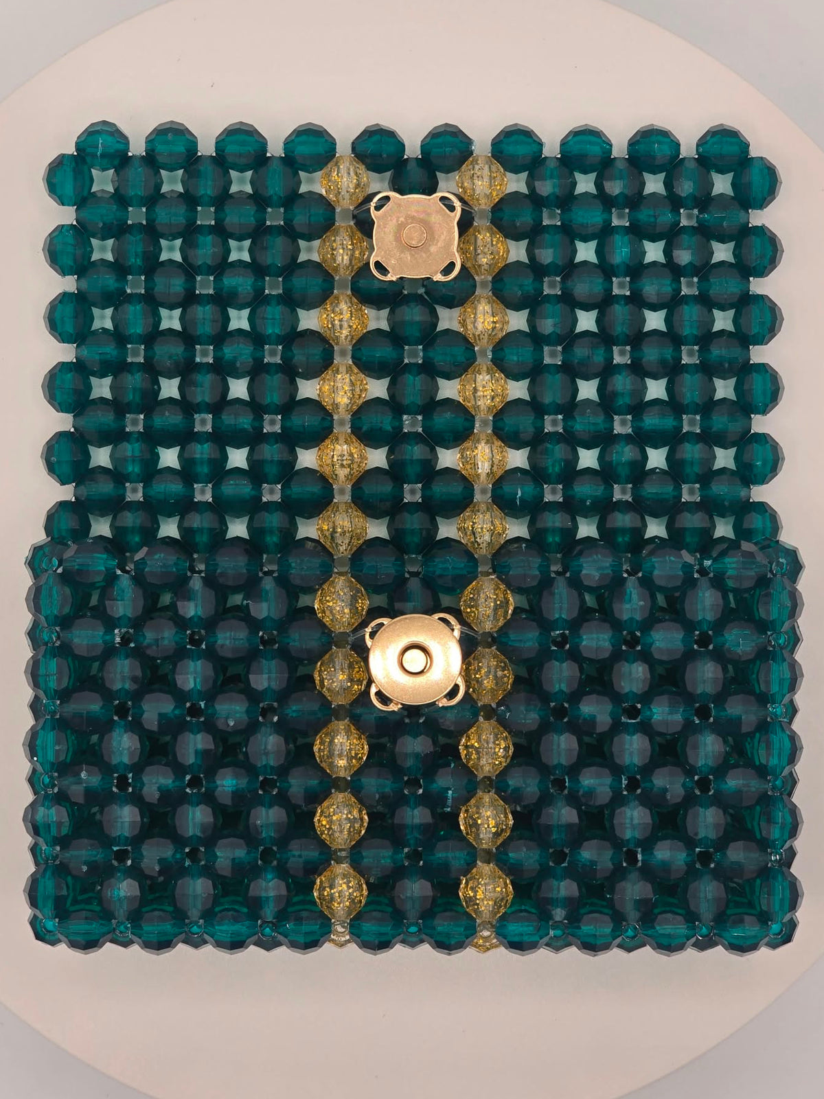 Open view of teal wallet with gold translucent stripes